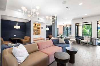 Resident co-working lounge with coffee bar and business center with pcs and wireless printing